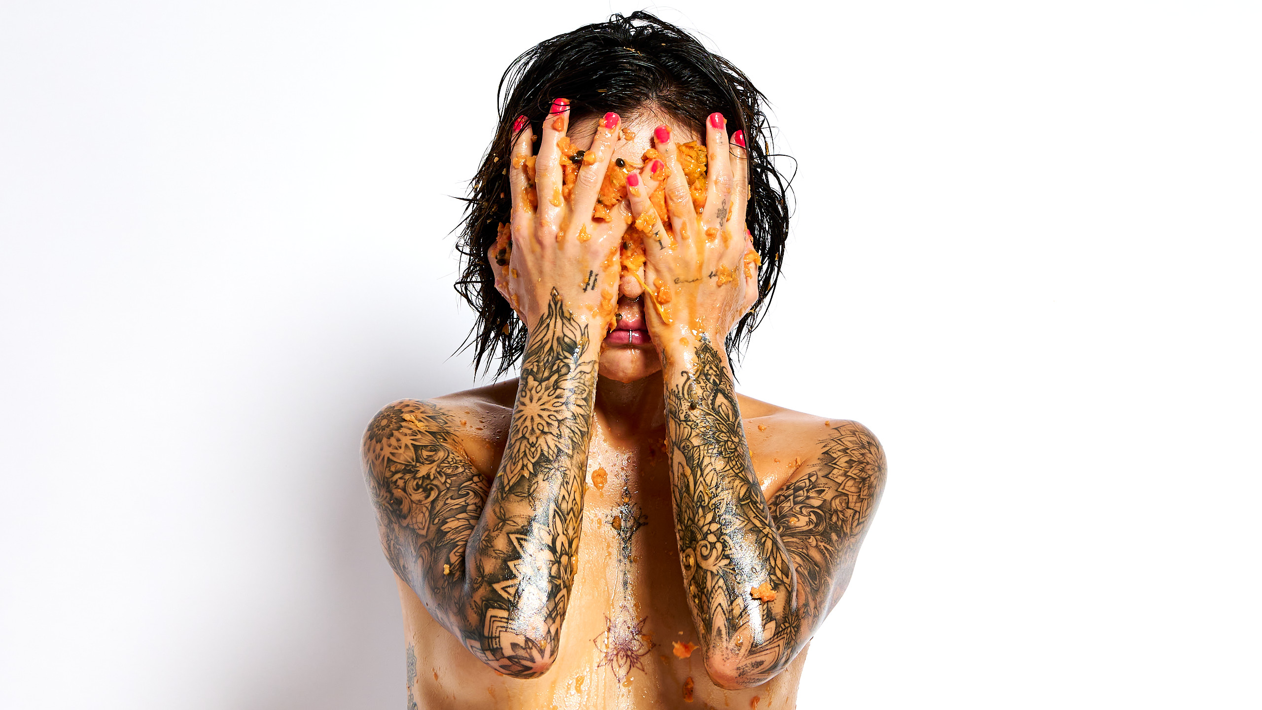 South Korean tattooed model Chloe Messy series orange papaya smearing wet nude body Barcelona photographer Cinaed Dane
