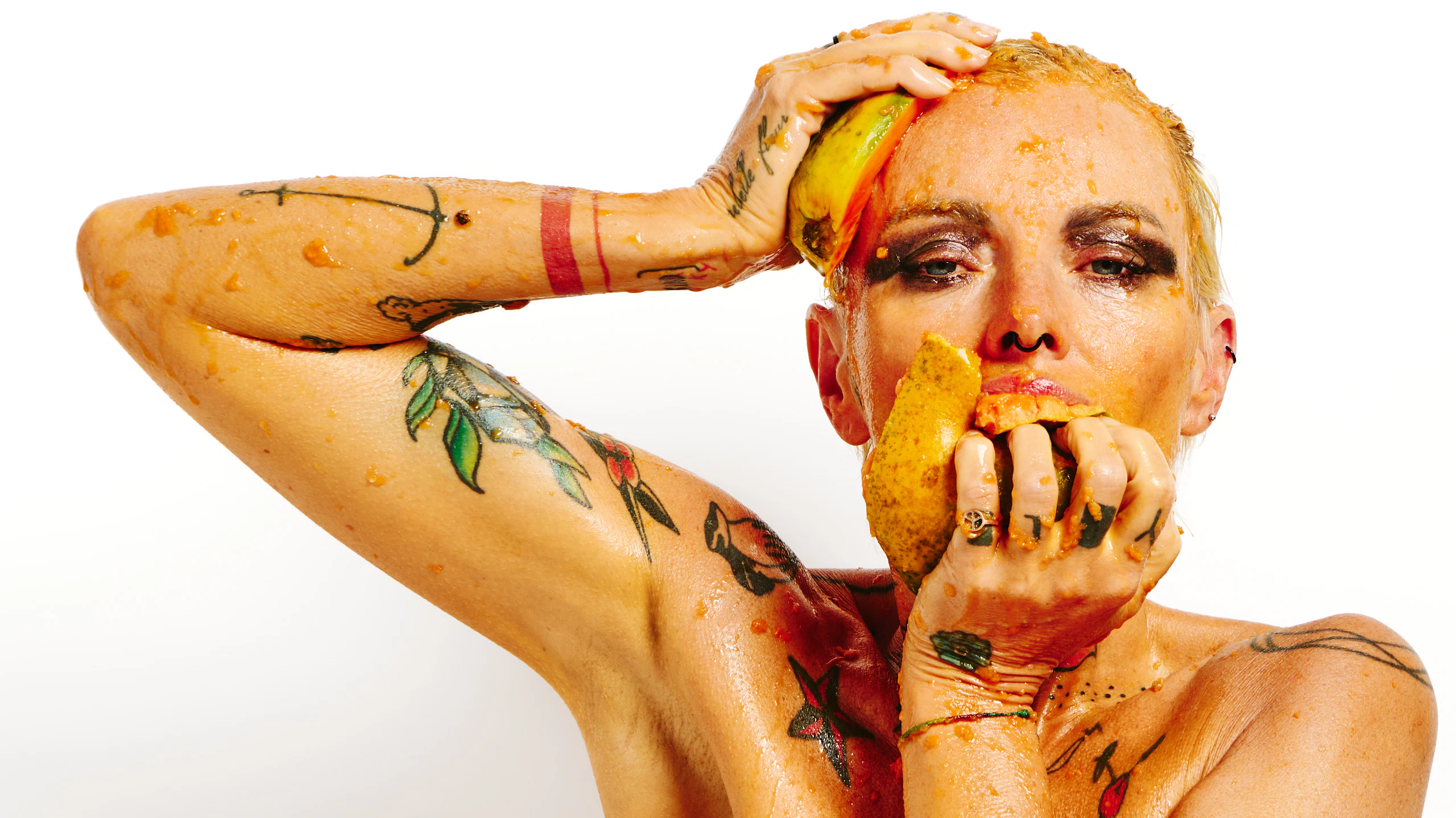 Erotic art portrait of Lu Epic nude with papaya fruit on her body and face