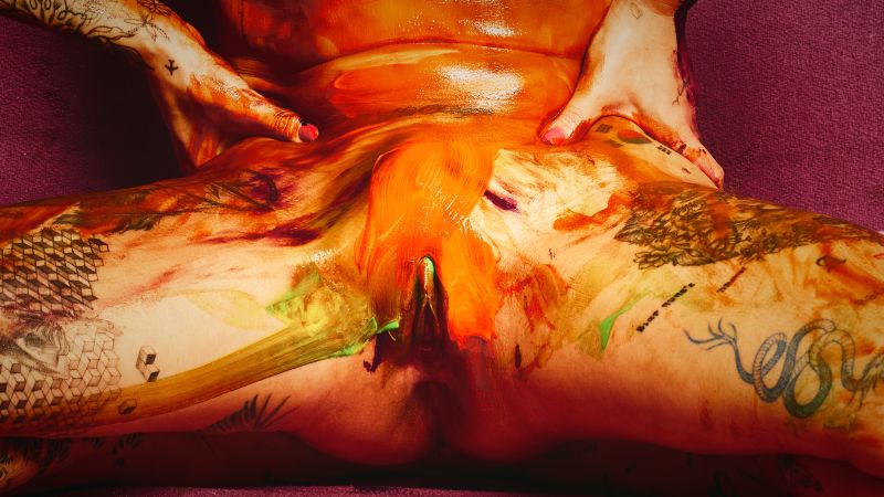 South Korean tattooed model Chloe Painter creative nude photography orange paint Barcelona Cinaed Dane