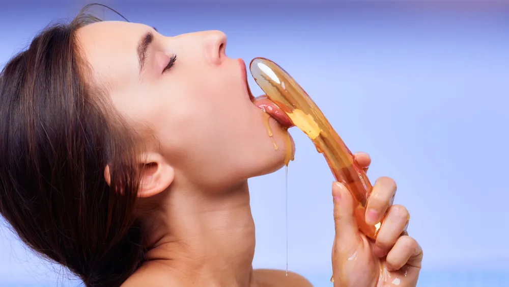 Expressive erotic art image featuring Gloria Sol with honey on skin