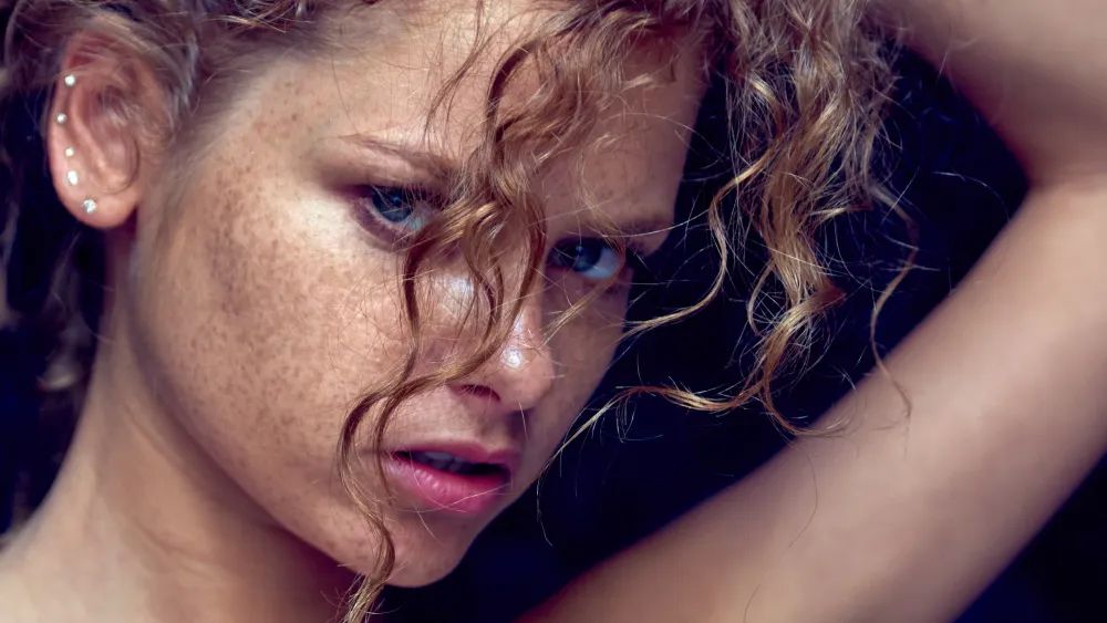 Portrait of Julia Yaroshenko with red hair, expressive face