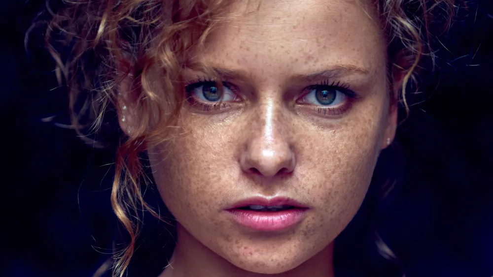 Close-up portrait of model Julia Yaroshenko with striking red hair