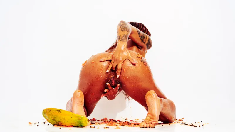 Contemporary nude art featuring African Beauty exploring fruit, texture, and body form.