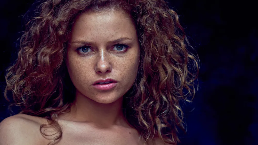 Expressive portrait photograph of red-haired Julia Yaroshenko