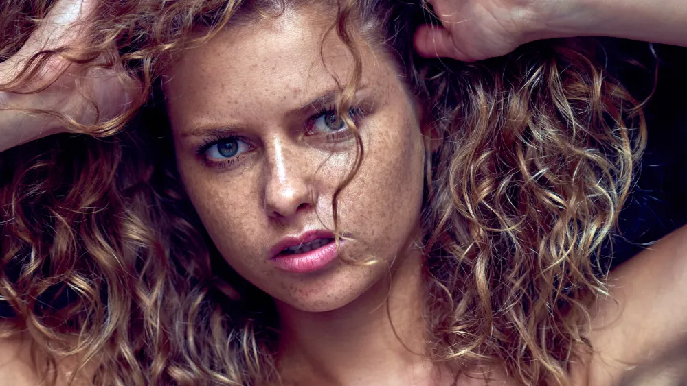 Close-up portrait of model Julia Yaroshenko with striking red hair